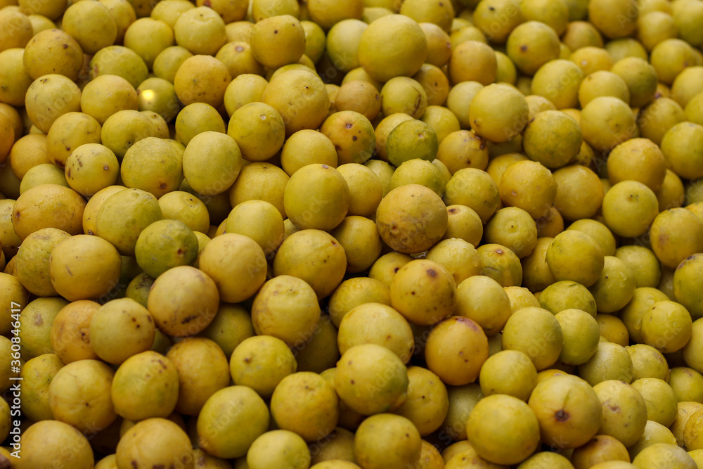 Lot of yellow lemons in a market