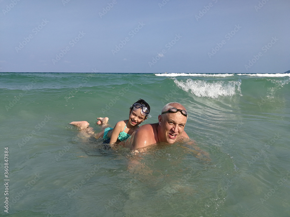 Dad and daughter on the waves
Dad and daughter on the waves