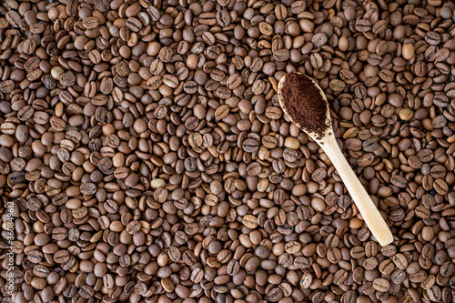 coffee beans on wooden spoon