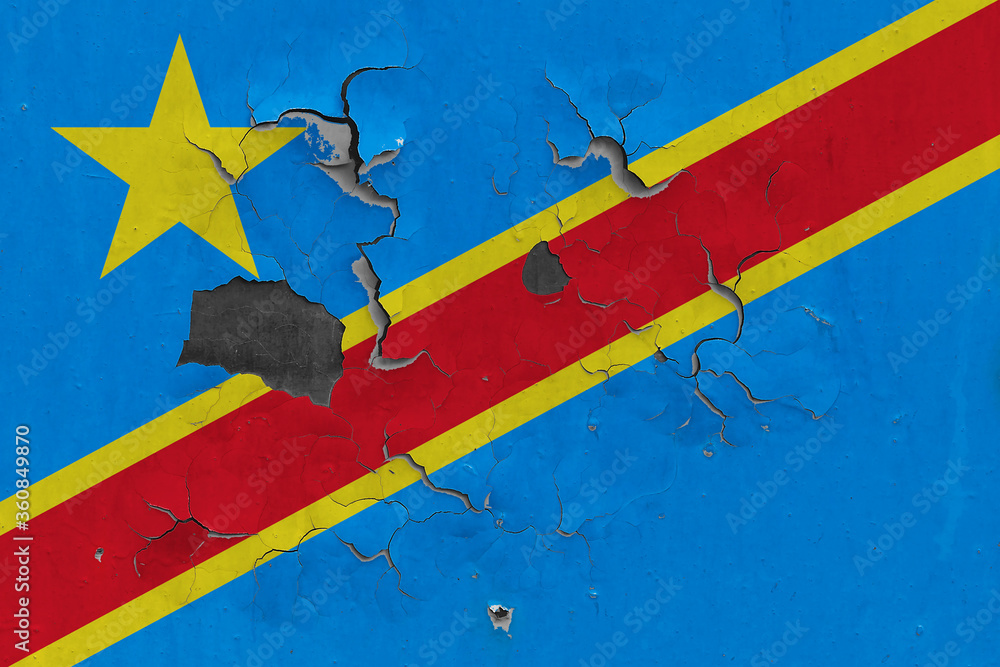 Congo flag close up old, damaged and dirty on wall peeling off paint to see inside surface. Vintage National Concept.