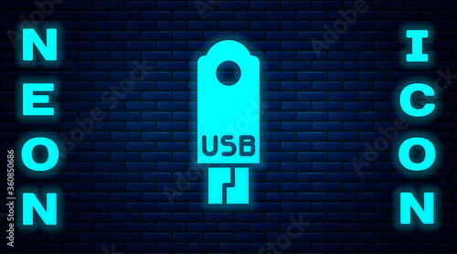 Glowing neon USB flash drive icon isolated on brick wall background.  Vector Illustration