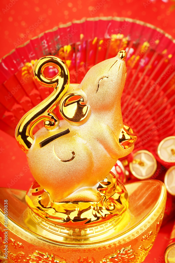 Fototapeta premium Tradition Chinese golden rat statue rat,2020 is year of the rat,Chinese characters on decoration translation: good bless for new year.