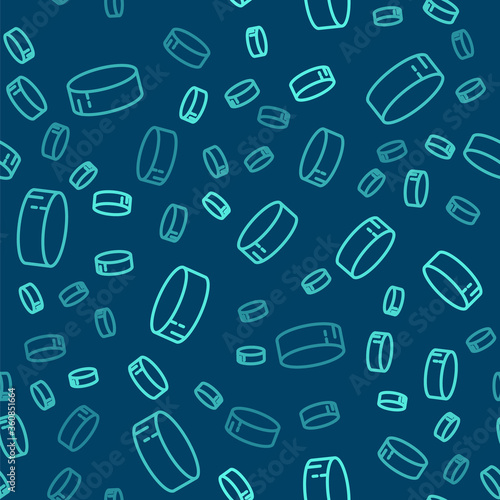 Green line Hockey puck icon isolated seamless pattern on blue background. Sport equipment.  Vector Illustration