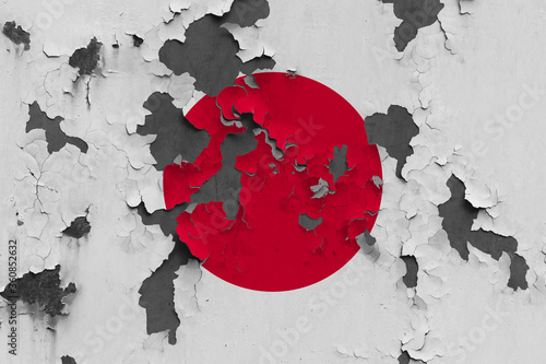 Canvas Print Japan flag close up painted, damaged and dirty on wall peeling off paint to see concrete surface