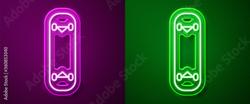 Glowing neon line Skateboard trick icon isolated on purple and green background. Extreme sport. Sport equipment.  Vector Illustration