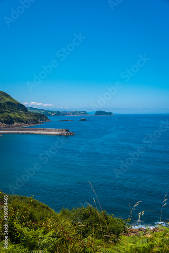 Detail of the viewpoint of the Orio coast, guipuzcoa, basque country. Excursion from San Sebastián to the town of Orio through Mount Igeldo walking 3 friends.
