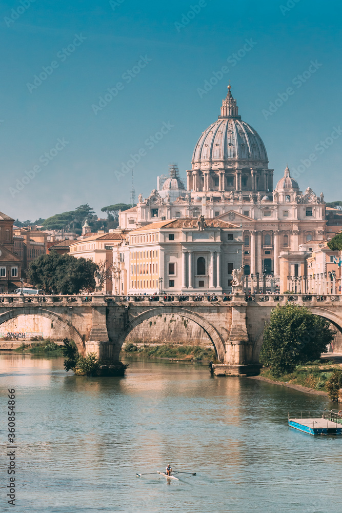 Rome, Italy. Man Training On Kayak Near Aelian Bridge. Papal Basilica Of St. Peter In The Vatican