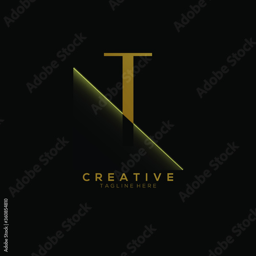 T Gold Letter Logo Design with Creative Paper Cut