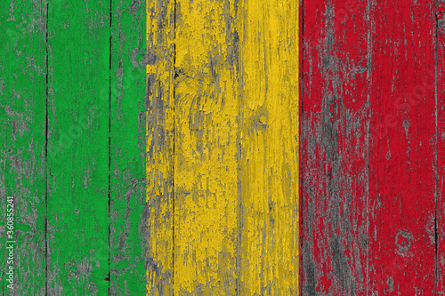 Mali flag on grunge scratched wooden surface. National vintage background. Old wooden table scratched flag surface.