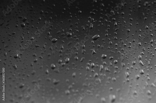 Raindrops on window glass condensation on the window natural background 