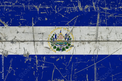 El Salvador flag painted on cracked dirty surface. National pattern on vintage style surface. Scratched and weathered concept. © sezerozger