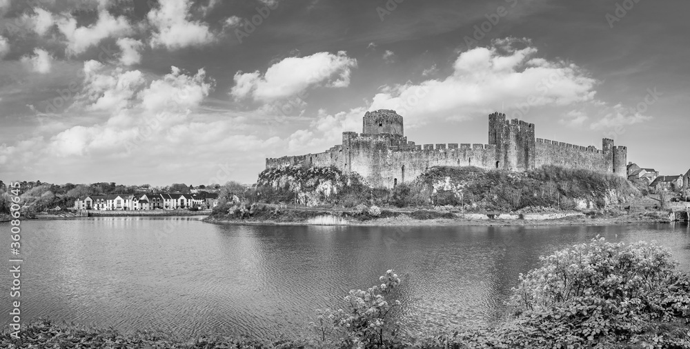 Pembrokeshire, Wales, UK: Landscape with the ruins of old medieval Pembroke Castle on the shores of river Pembroke, the original family seat of the Earldom of Pembroke