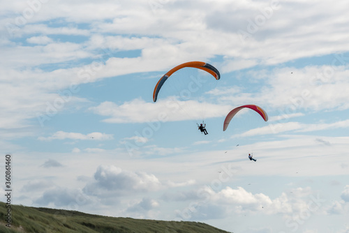 paragliding in the blue sky