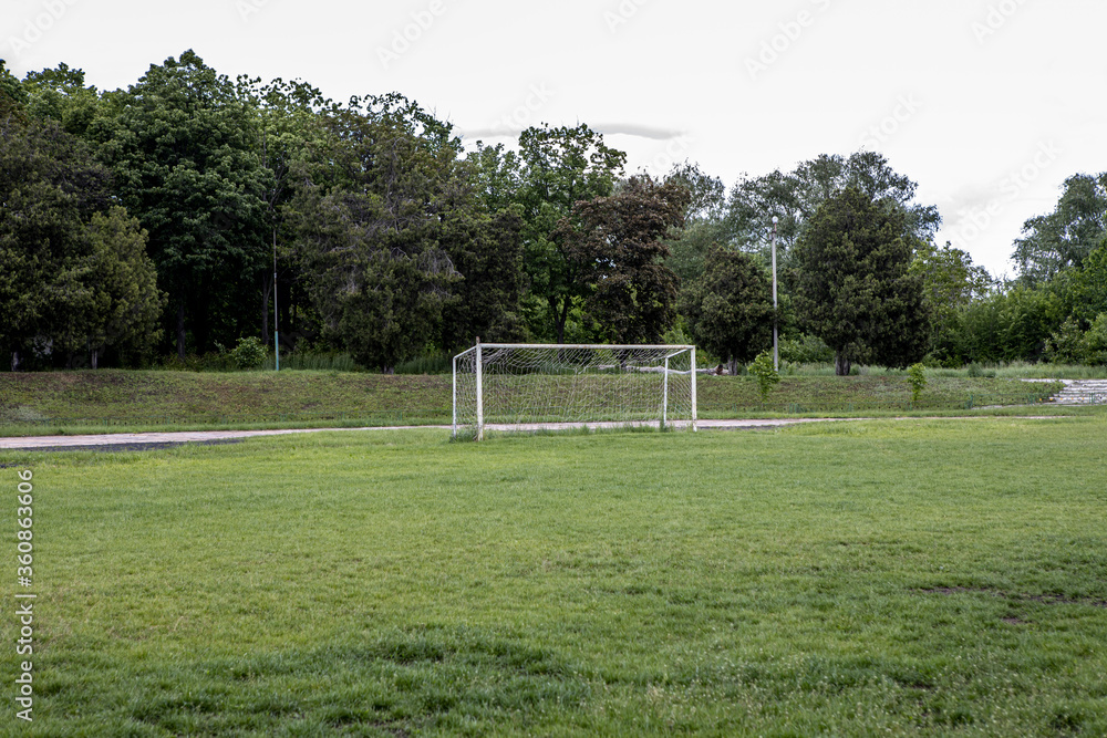 Fototapeta premium old white gate on the football field. Sports outdoors