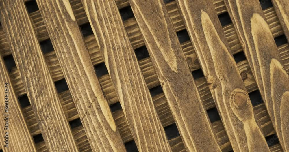 Wooden lattice texture on a black background. Rotation. Wooden lattice texture on a black background. Rotation.