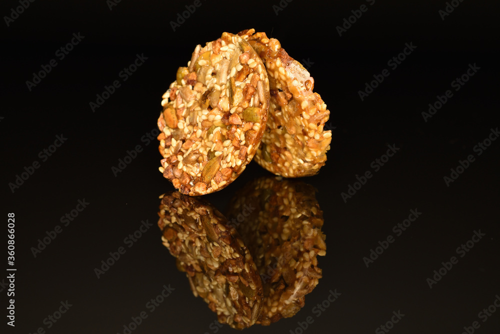 Several fresh fragrant tasty nutty cookies on a black background. Several fresh fragrant tasty nutty cookies on a black background.