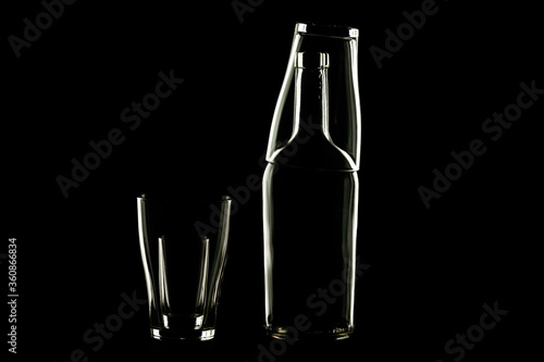 bottle and stacks empty without content on a dark background are highlighted along the contour