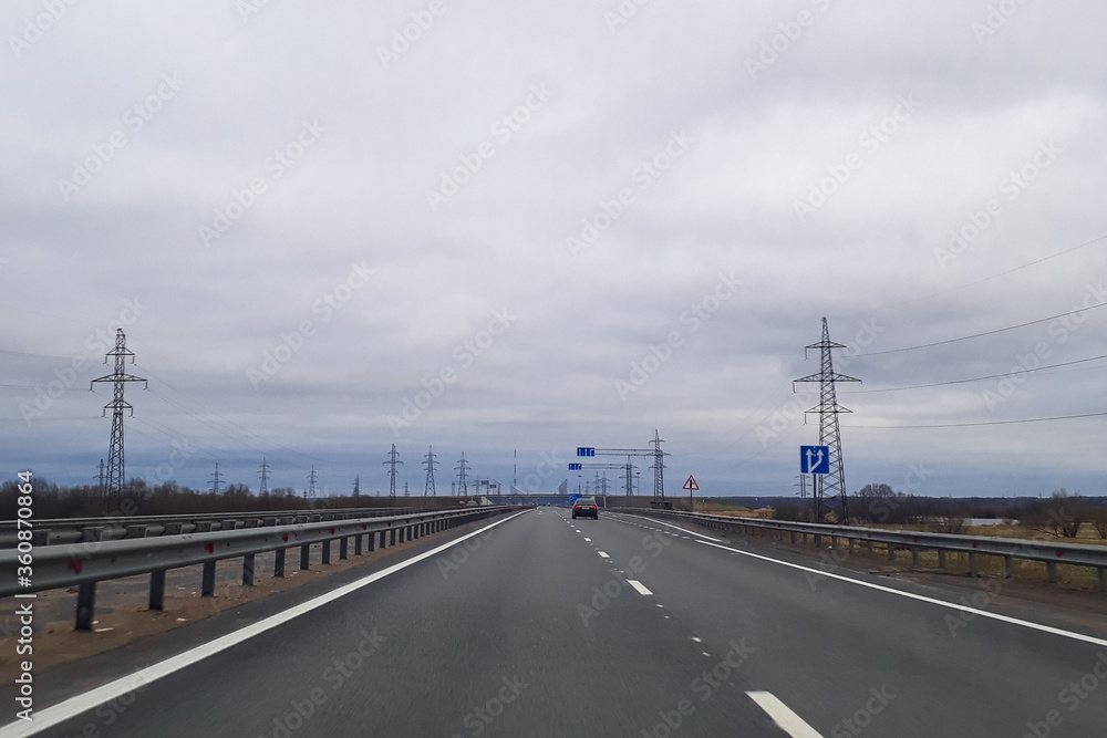 A road or a highway, the highway stretches to the horizon. View from the car window. Journey, the way home. A road or a highway, the highway stretches to the horizon. View from the car window. Journey, the way home.