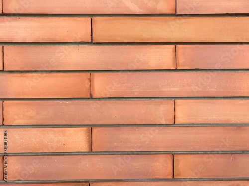 The red brick wall can be used as a background.