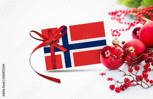 Photography Norway flag on new year invitation card with red christmas ornaments concept