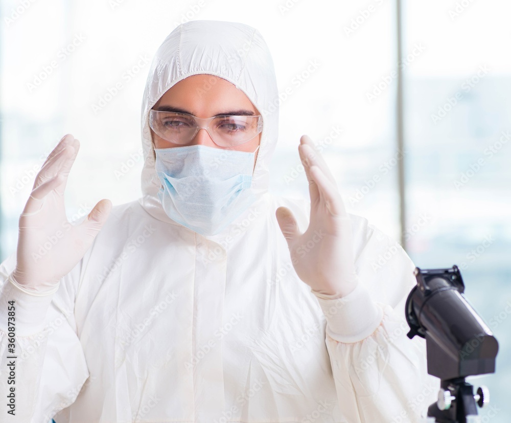 Young chemist student working in lab on chemicals Young chemist student working in lab on chemicals