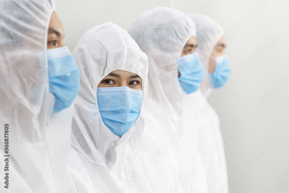 Team of Medical Research Scientists Working in PPE Suit. Team of Medical Research Scientists Working in PPE Suit.