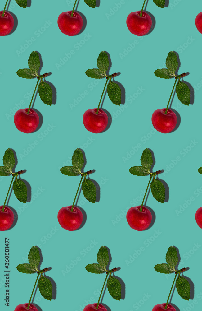 Sweet red cherry fruits with hard shadows flat lay on pastel turquoise background pattern, website vertical banner. Creative layout of fresh summer berries. Food fun concept. Trendy pop art design. Sweet red cherry fruits with hard shadows flat lay on pastel turquoise background pattern, website vertical banner. Creative layout of fresh summer berries. Food fun concept. Trendy pop art design.
