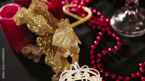 Wallpaper Mural Extinct red candles, red beads and New Year decorations on the table Torontodigital.ca