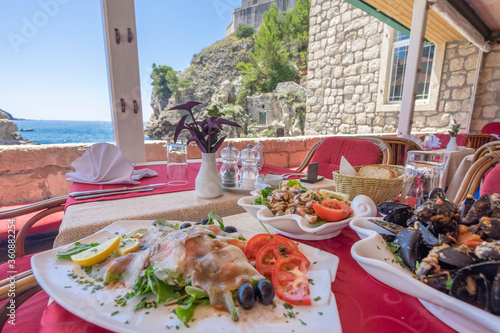 Fototapeta Naklejka Na Ścianę i Meble -  Seafood restaurant with an ocean view in Dubrovnik, Croatia