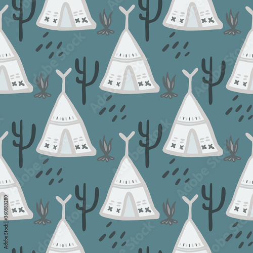 Cute teepee seamless pattern on green background. Native style. Tribal wallpaper.