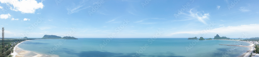 Panoramic of prachuap bay in thailand Sea and beach with blue sky background.