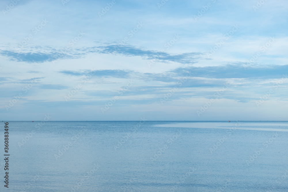 Blue sky over a calm sea in Thailand.