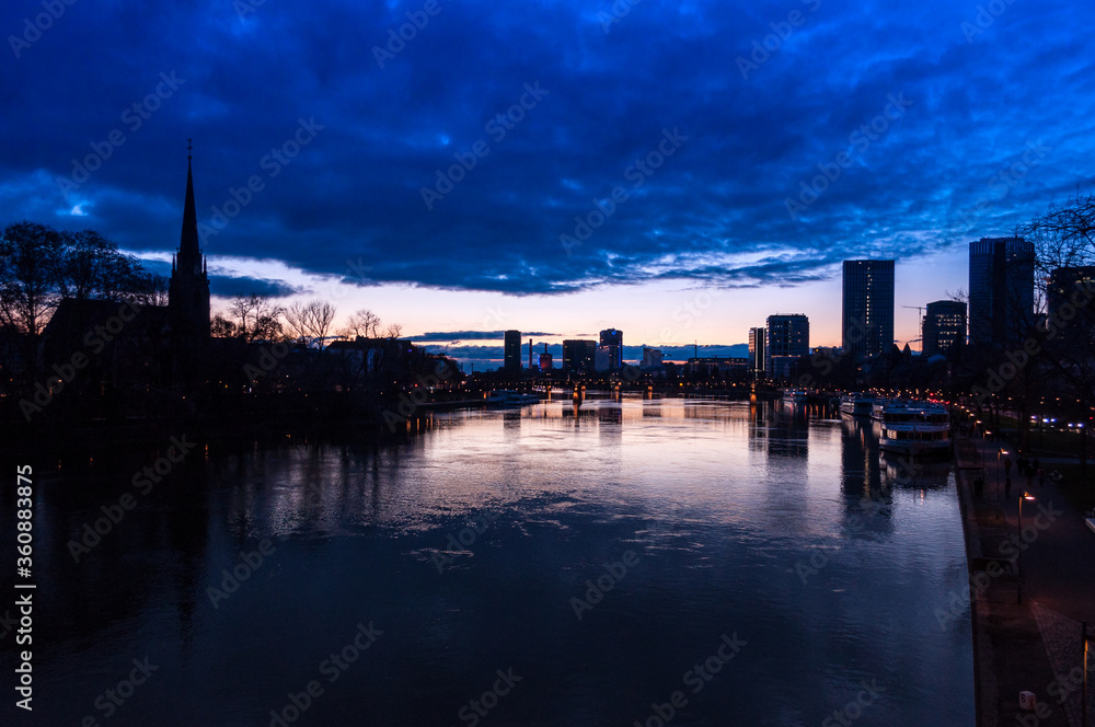 Fototapeta premium Spectacular view on the night city of Frankfurt reflecting in the river
