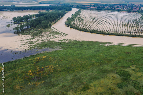 Flooded plain countryside landscape and river from drone pov photo