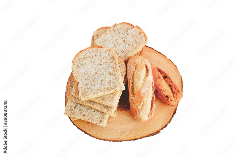 Isolated of some bread and buns on a wooden board. Food on white background.