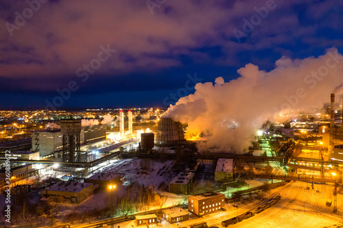 Night top view of a steel mill. Smog  smoke and flame from the chimneys