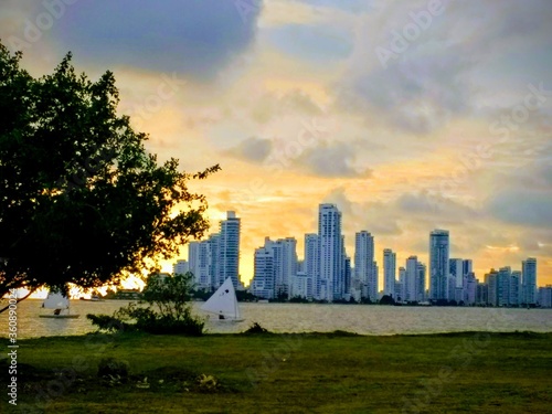 Silhouette of a Coastal City at Sunset