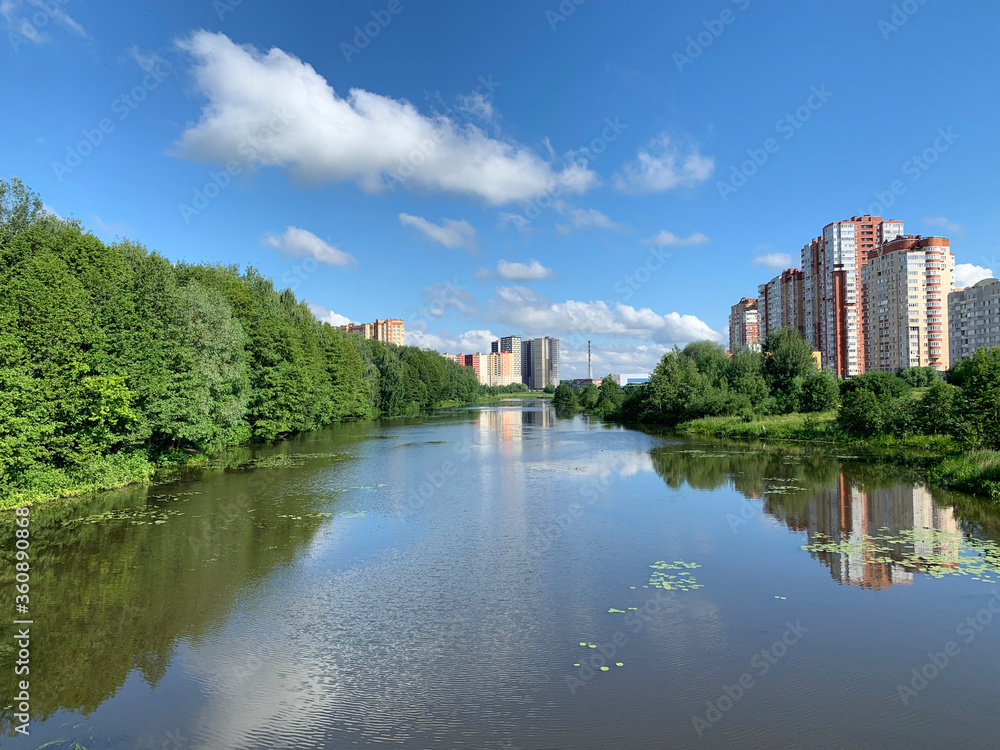Moscow region, the city of Balashikha. Pekhorka river in summer day and view of Zarechnaya street Moscow region, the city of Balashikha. Pekhorka river in summer day and view of Zarechnaya street