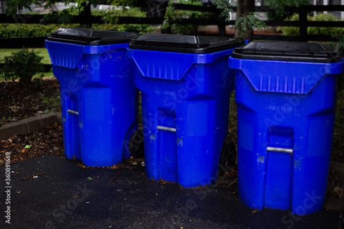 Set of three recycle trash container on a rainy morning © Ivelin