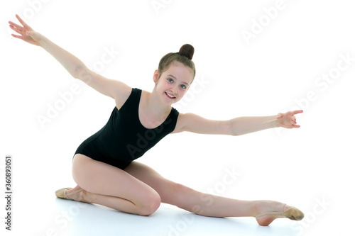 The gymnast perform an acrobatic element on the floor.