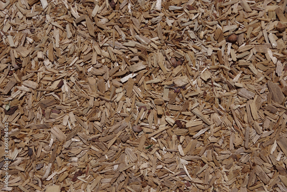 High angle full frame close-up view directly from above of a part of an area with chipped wood as a ground cover High angle full frame close-up view directly from above of a part of an area with chipped wood as a ground cover