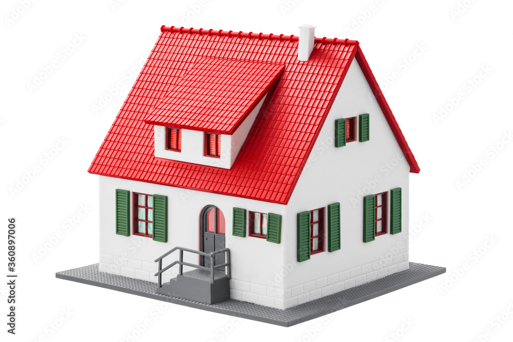 Miniature house isolated on a white background with clipping path. Real estate family home for sale. Miniature house isolated on a white background with clipping path. Real estate family home for sale.