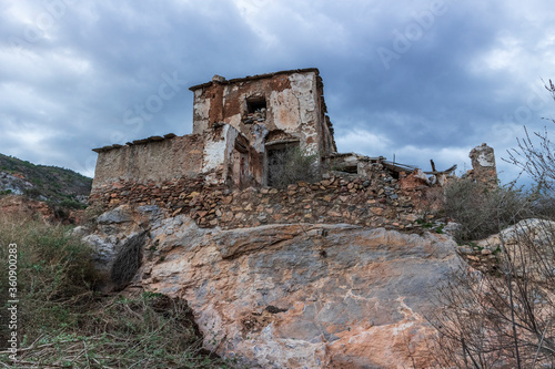 ruins of a country house built on top of large rock