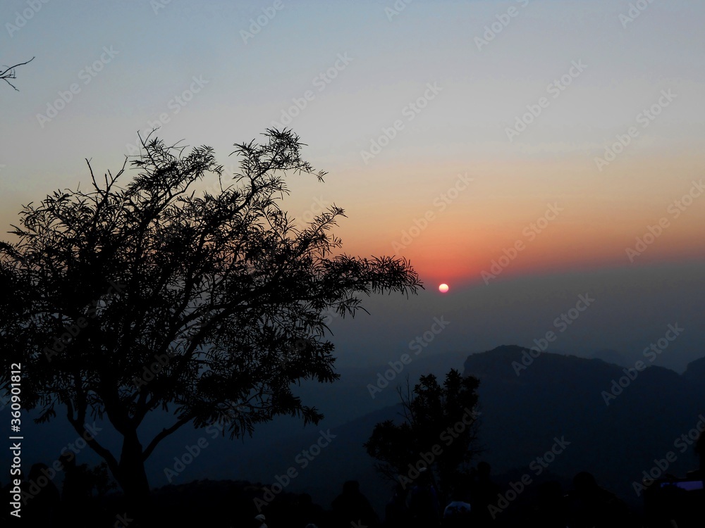 Fototapeta premium A beautiful sunset view from the hills