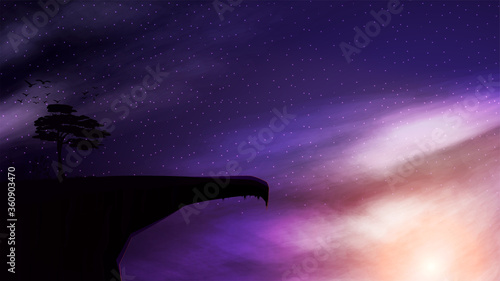 A mountain cliff with a single tree growing on it against the background of the starry sky at sunset.