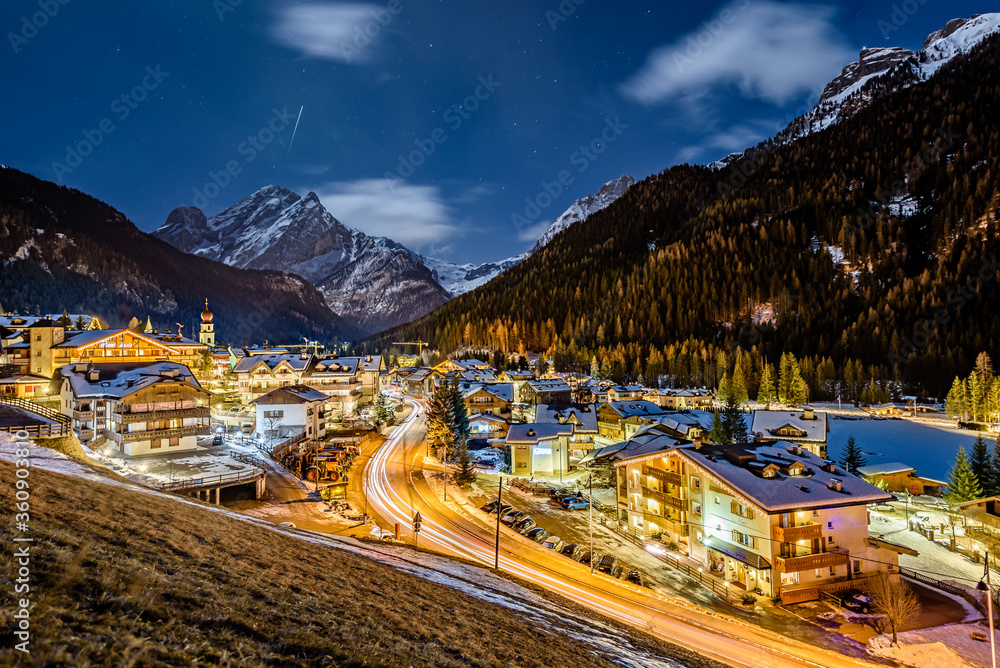A night shot of city of Canazei. Its a comune (municipality) in Trentino in the northern Italian region Trentino-Alto Adige/Südtirol, located in the upper part of the Val di Fassa.