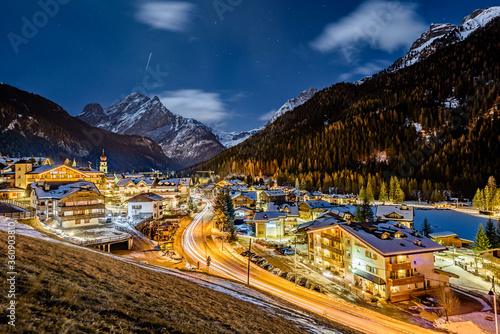 Obraz na płótnie A night shot of city of Canazei. Its a comune (municipality) in Trentino in the northern Italian region Trentino-Alto Adige/Südtirol, located in the upper part of the Val di Fassa. w salonie