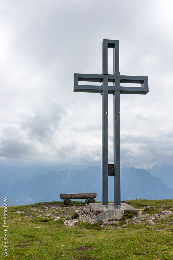 View of the big cross at the top of Loser peak in Dead Mountains (Totes Gebirge) group of mountains in Austrian Alps