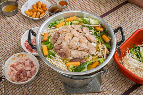 Thai barbecue Grill Pork on hot pan. Barbecue buffet pig pan and vegetables in soup. Thai food.