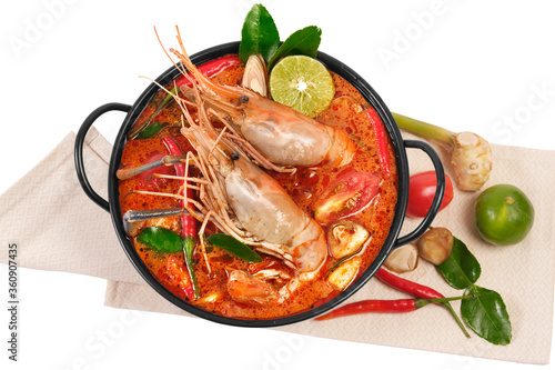 Thai food Tom Yum Kung.Thai hot and spicy soup shrimp in bowl.with Straw Mushroom,lime,Kaffir lime leaves,tomato and chilli. Splash on the air. isolated on white background.